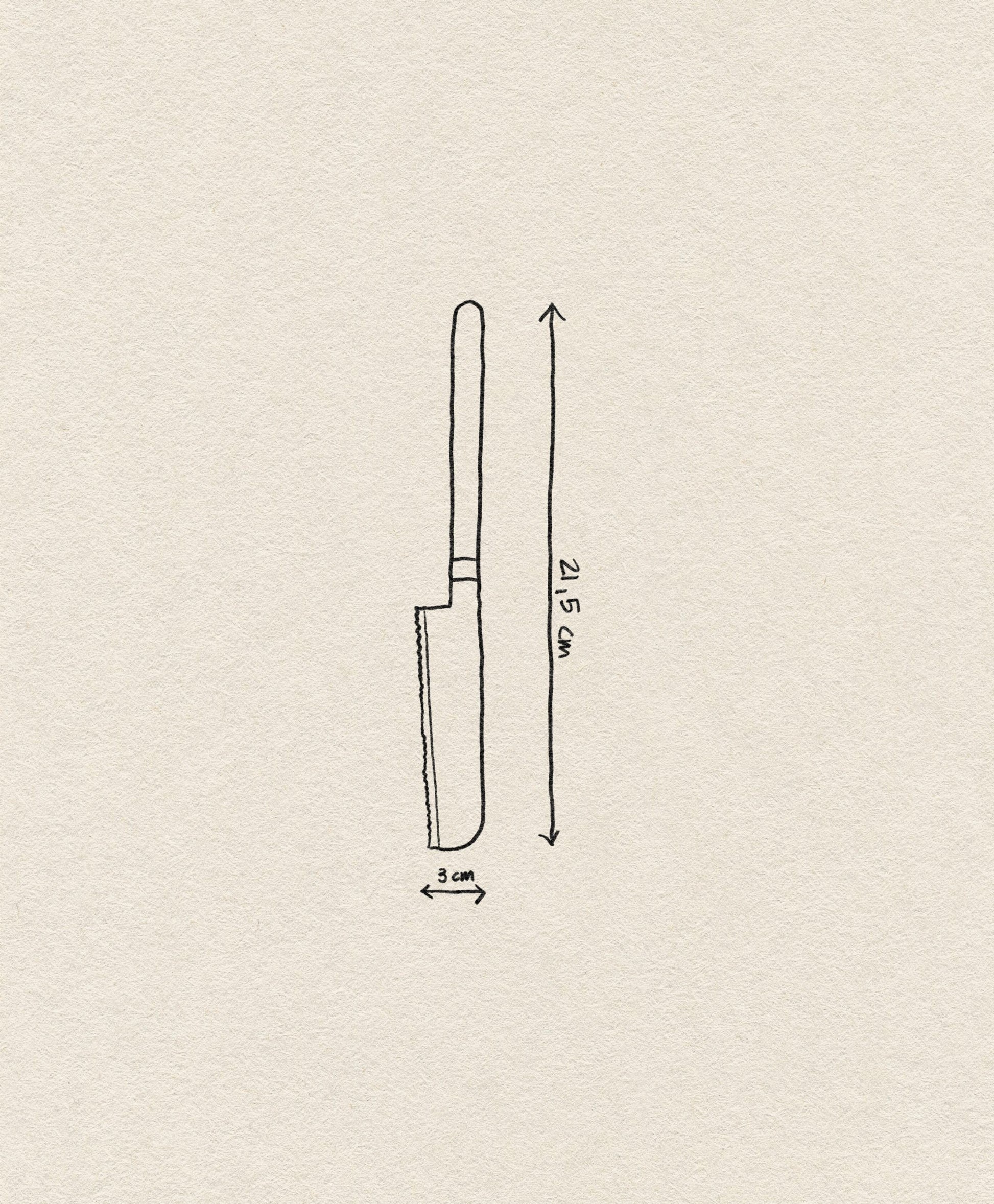 The Normann Copenhagen Pebble Cheese Knife features a 3 cm wide blade and is 21.5 cm long. Displayed on a plain off-white background, its subtle Scandinavian design highlights the craftsmanship of Normann Copenhagen.