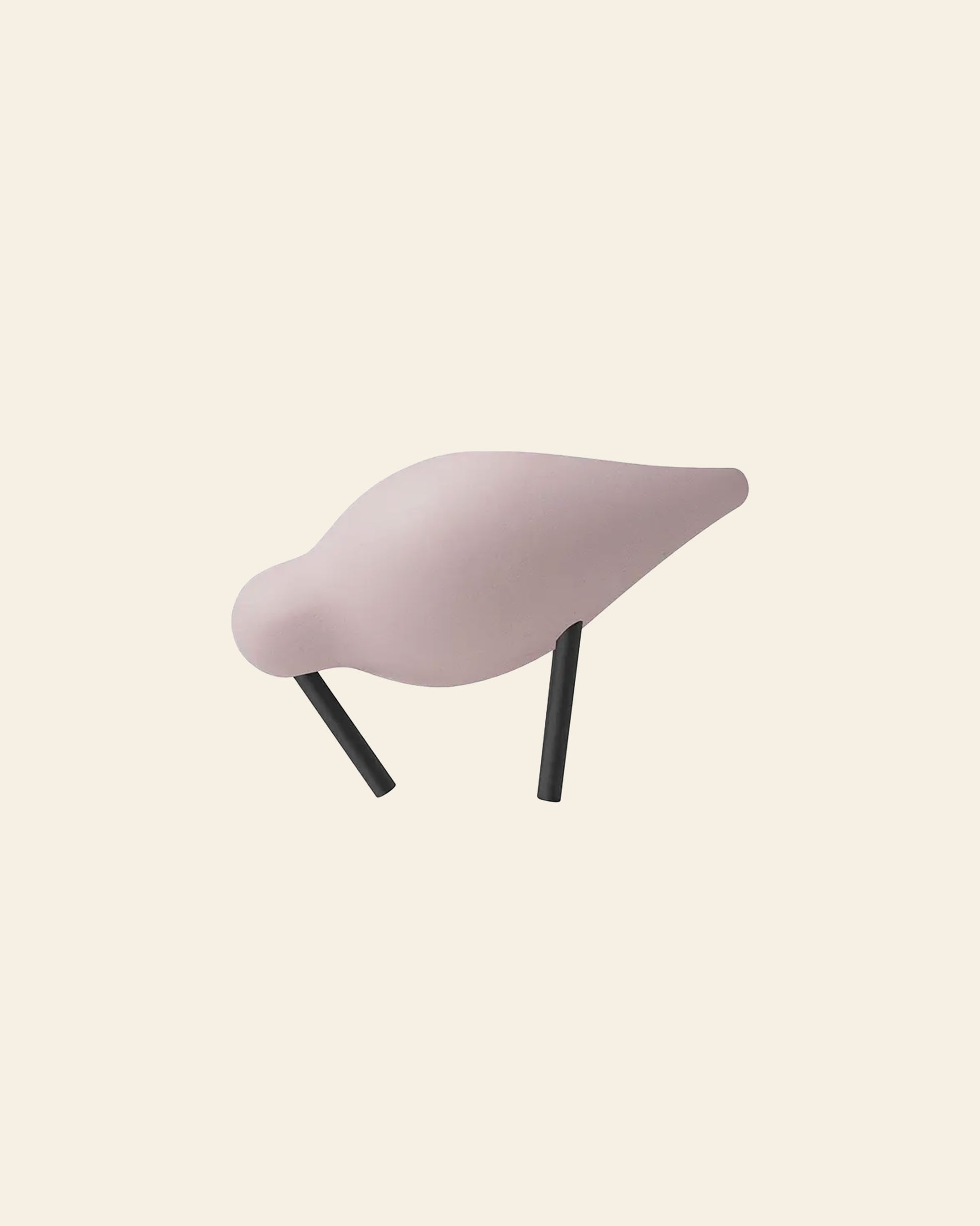 The Normann Copenhagen Shorebird Small Oak is a minimalist, light pink bird sculpture with black legs by Normann Copenhagen, perfect as elegant nature-inspired decor against a neutral backdrop.