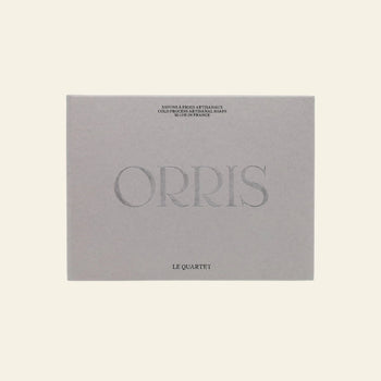 A beige ORRIS Le Quartet box features the brand name ORRIS prominently and contains botanical soap face and body cleansing bars, set against a light background.
