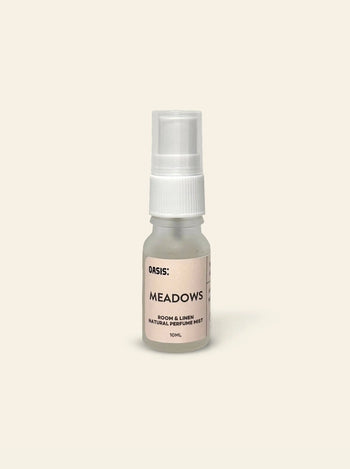 A 10ml spray bottle of Oasis Beauty Kitchen Room and Linen Mist by Oasis Beauty Kitchen rests on a plain, light beige background, offering a perfume-grade mist with fresh linen notes for a clean, inviting ambiance.