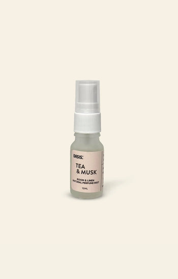A 10ml Oasis Beauty Kitchen Room and Linen Mist by Oasis Beauty Kitchen rests on a light beige background, delivering a perfume-grade spray with fresh linen notes for natural air refreshment.