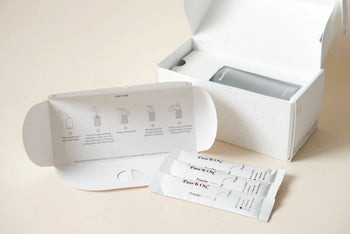 The Pass It On 0.02 Refillable Hand Wash Set, Pack of 3-Marine Moss by Pass It On is displayed with an open box, instruction card, and three soap packets on a light surface, evoking the refreshing vibe of marine moss.