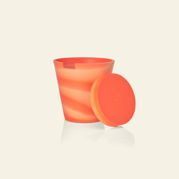 The Plastic Ark Dirty Pot by Plastic Ark is a reusable cup featuring an orange and light peach swirl pattern, styled like a garden pot, shown with its matching orange lid on a light background.