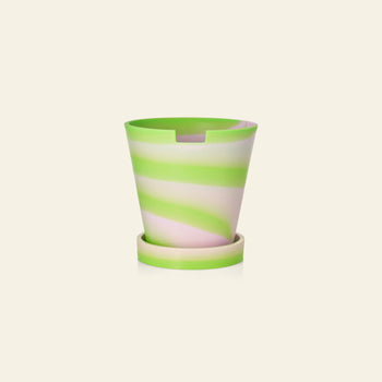 The Plastic Ark Dirty Pot by Plastic Ark is a recycled plastic plant pot with matching saucer, featuring a swirl pattern in pastel green and light pink on beige—ideal for sustainable gardening.