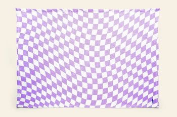 The Poketo Linen Tea Towel, Set of 2 by Poketo features a purple and white wavy checkerboard pattern that creates an optical illusion, making these linen towels a unique and colorful addition to your kitchen.