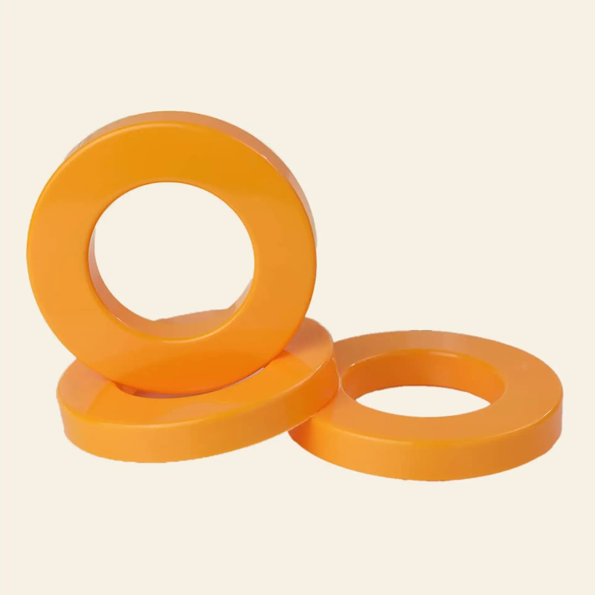 Three colourful Ring A Date Calendar Rings by Ring-A-Date—two flat, one upright—are displayed on a light background, echoing the customizable spirit of Ring-A-Dates signature wall calendars.