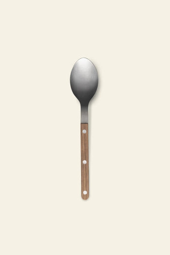 The Sabre Bistrot Vintage Soup Spoon by Sabre features a wide, rounded stainless steel bowl and a wooden handle with three circular holes, displayed on a plain light background.