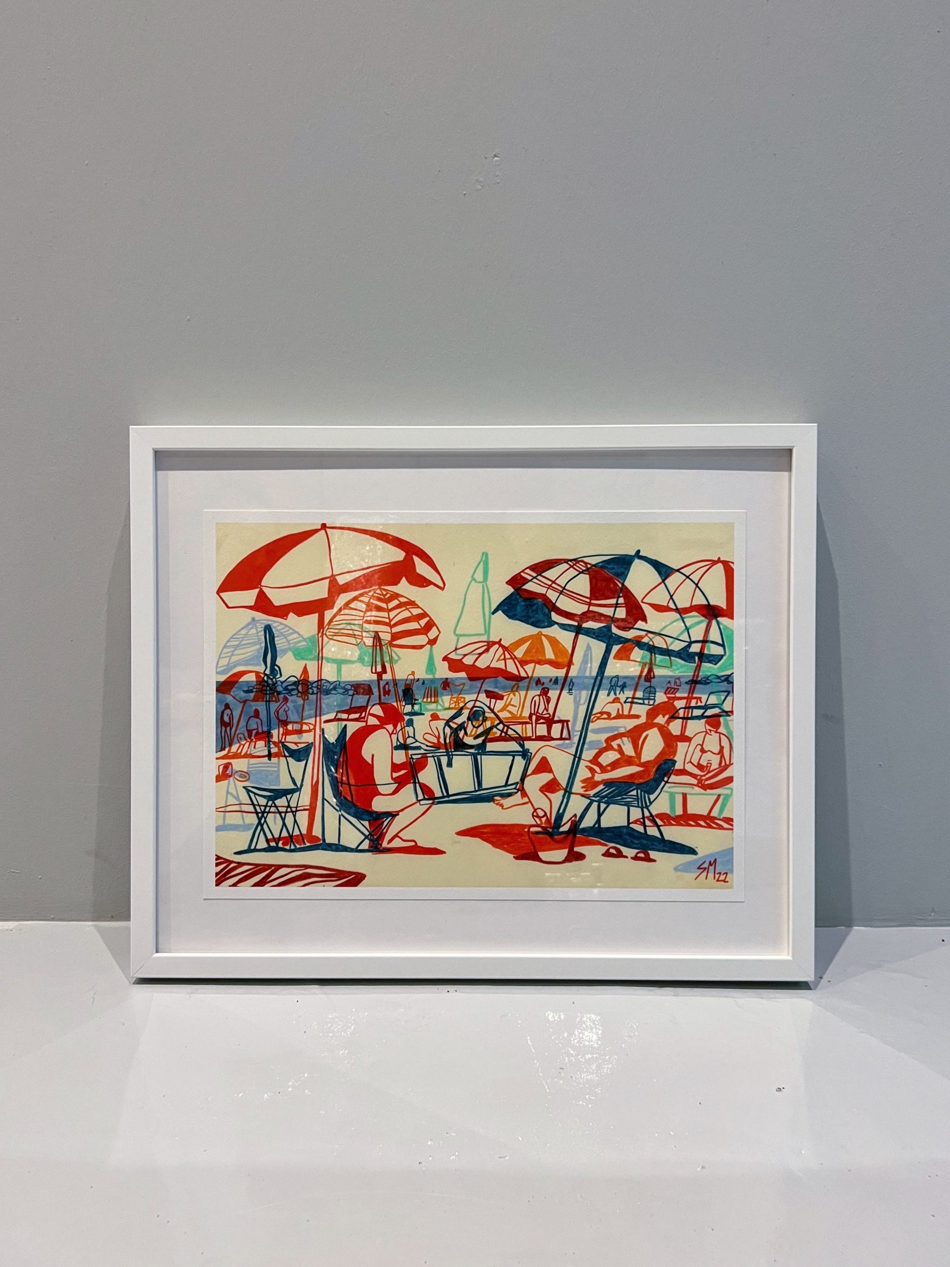 The Cesano 22, Print (Limited Edition Run) by Sarah Mari Shaboyan is a framed illustration of a vibrant Italian beach scene with red and blue umbrellas and sunbathers, ideal for display against a plain gray wall. Includes Certificate of Authenticity.
