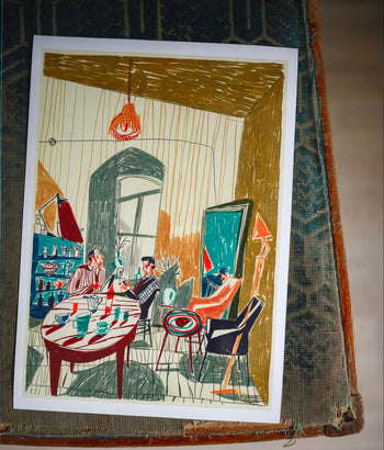 Evening at Mirzoyan Librarys Caffe, Print by Sarah Mari Shaboyan features a colorful illustration of people around a dining table in a stylish, cozy room with art, plants, and a large window. A tea cup sits on the patterned surface below.