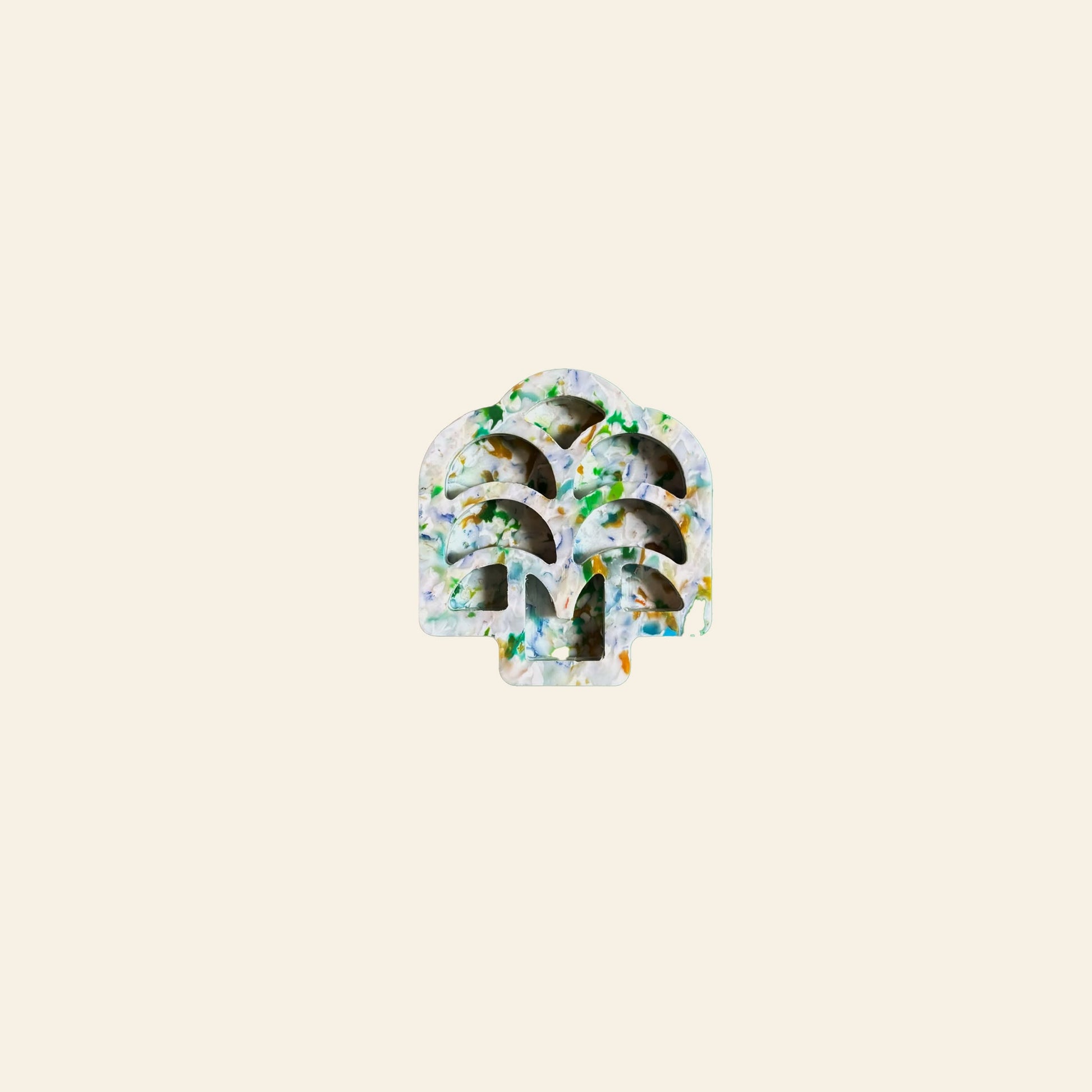 A tree-shaped symbol with a watercolor texture in green, blue, and yellow appears on a light beige background—reflecting the creative spirit of the School of Tomorrow Paint Palette by School of Tomorrow.