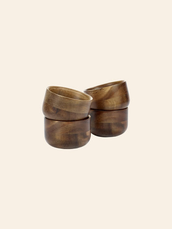 The Serax Collage Tea Cup in brown, by Serax, features a sleek design and smooth finish, displayed against a plain light beige background—a perfect accent for your Collage collection.