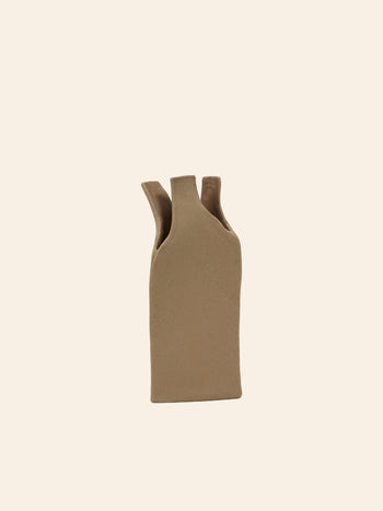 The Serax Flower Bottles Vase M in brown, by Serax, features a rectangular ceramic design with three narrow, uneven top openings—ideal for minimalist decor—displayed against a pale, off-white background.