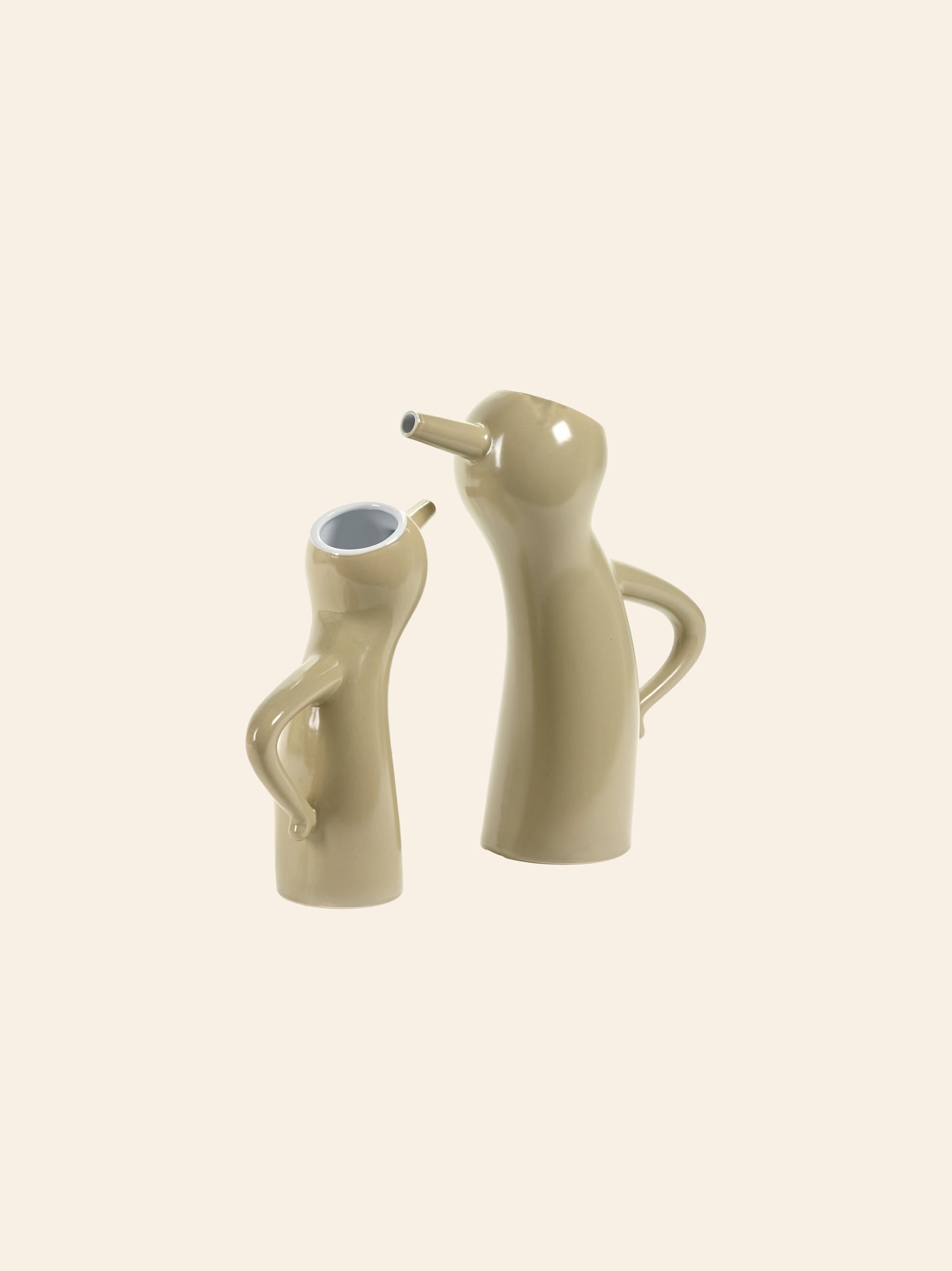 The Serax Monsieur Cruchot Jug L in taupe by Serax features a playful, anthropomorphic design with small arm-like handles—ideal as versatile home decor on a plain background.