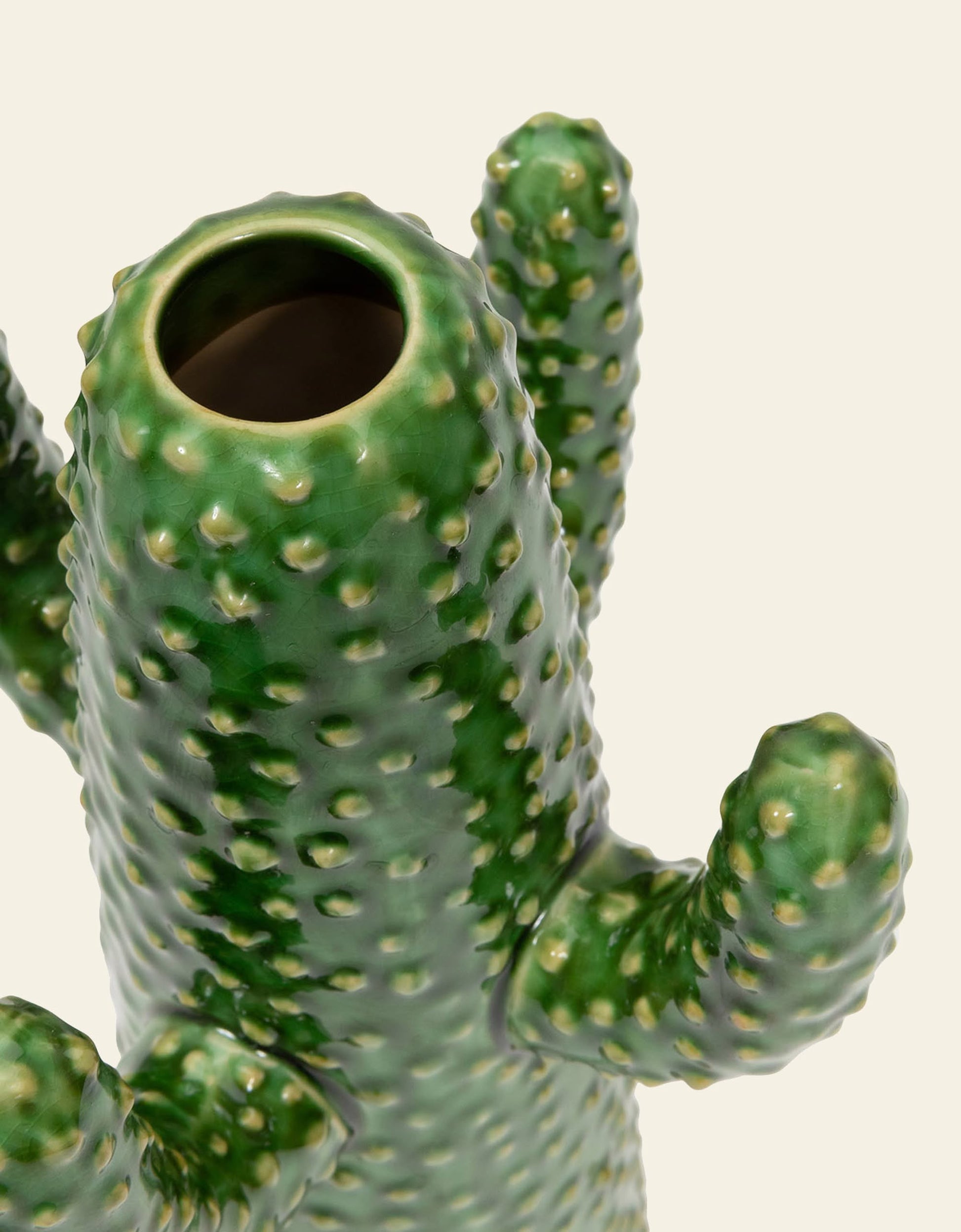 A close-up of the Serax Urban Jungle Cactus Vase M - Green by Serax, featuring a textured cactus shape with three arms and an open top, set against a plain light background.