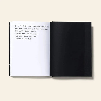 An open book from Shrig Shop titled David Shrigley - I Am The Jug You Are The Glass features a handwritten poem on the left page and a blank black right page, playfully exploring identity and absence.