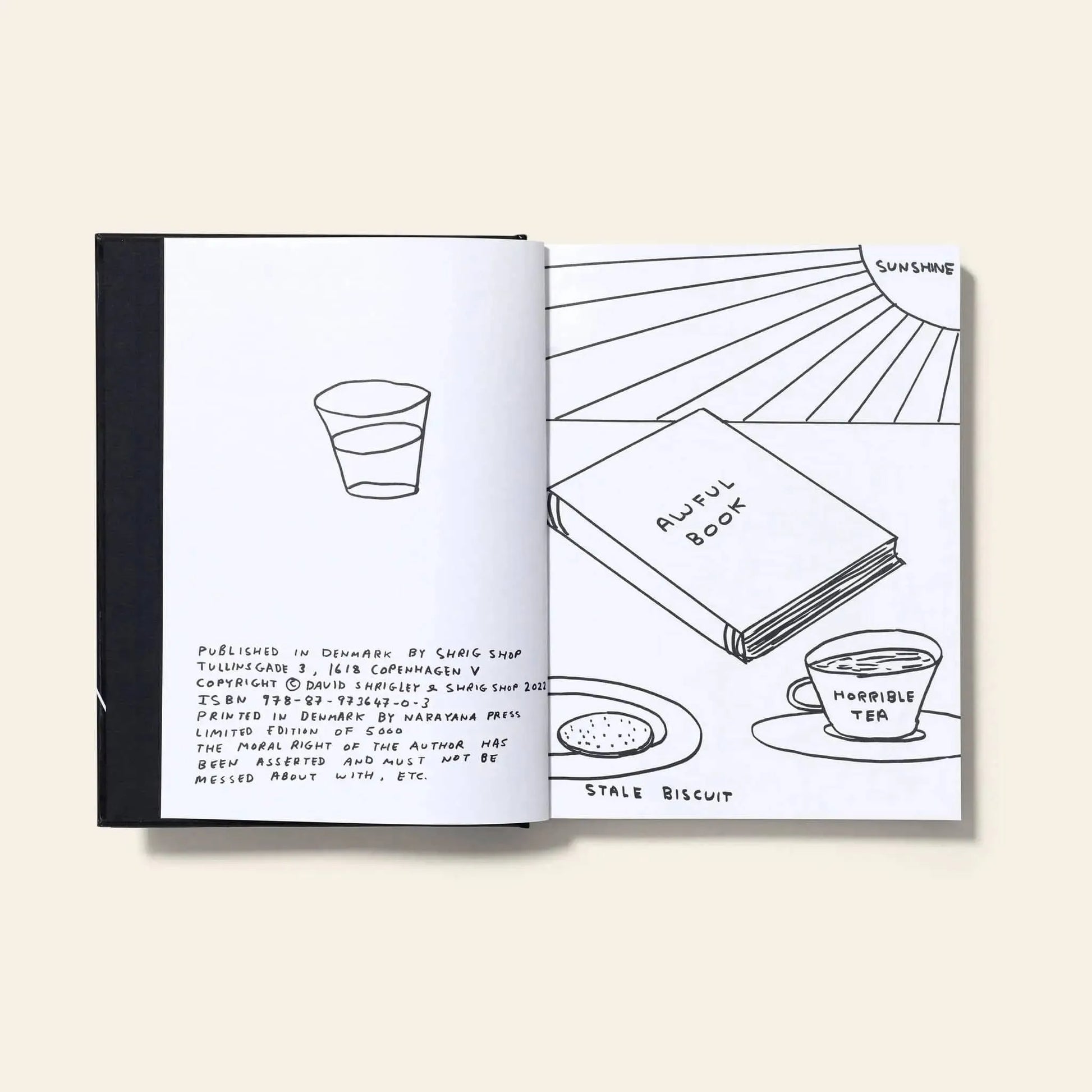 Explore the quirky limited edition I Am The Jug You Are The Glass by Shrig Shop—an open David Shrigley book with black and white drawings of a glass, an AWFUL BOOK, HORRIBLE TEA cup, STALE BISCUIT biscuit, and SUNSHINE.