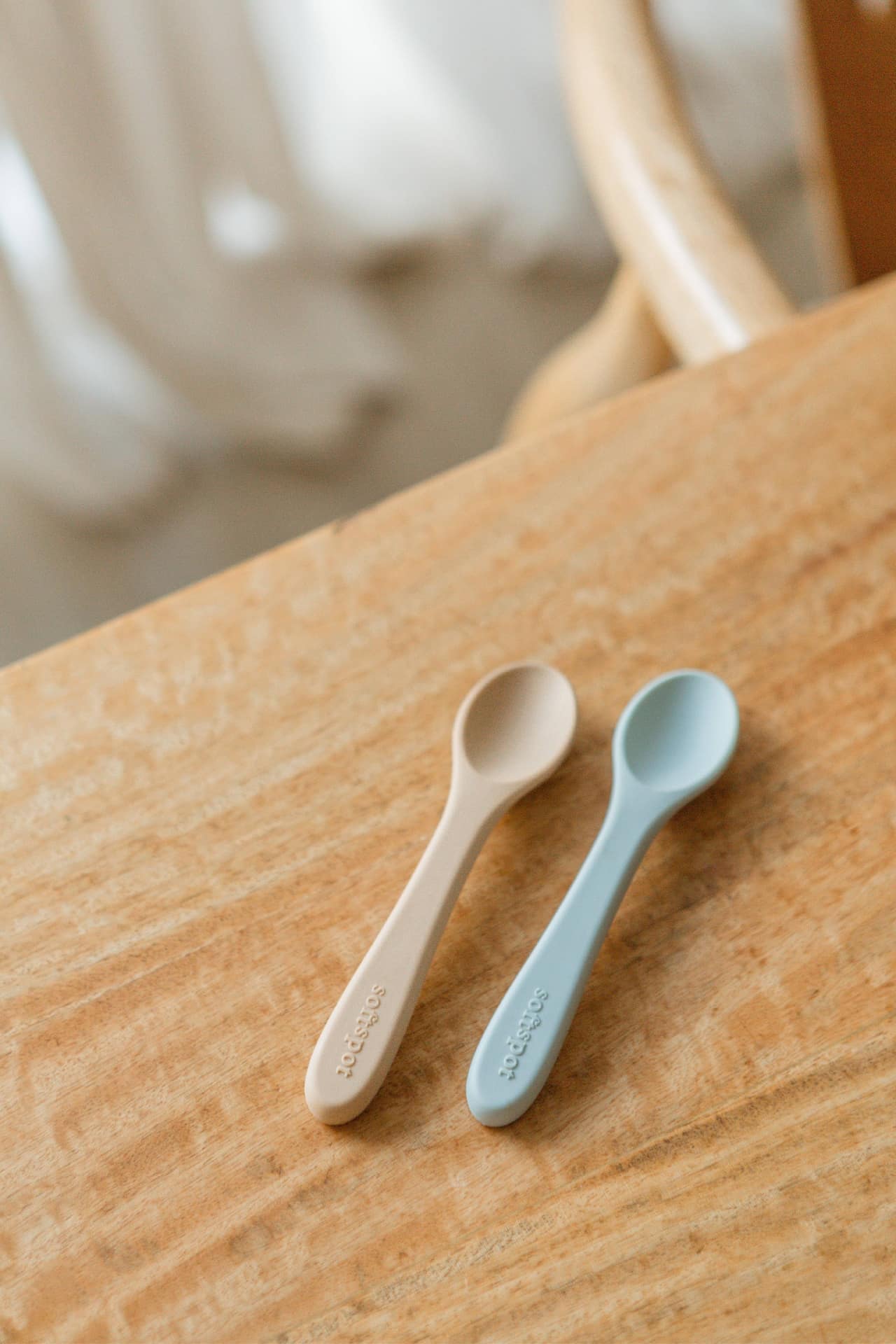 The Soft Spot Soft Baby Spoons, Set of 2 by Soft Spot, includes one beige and one light blue spoon—perfect for babys first bites, gentle on teething gums, and easy to use at feeding time.