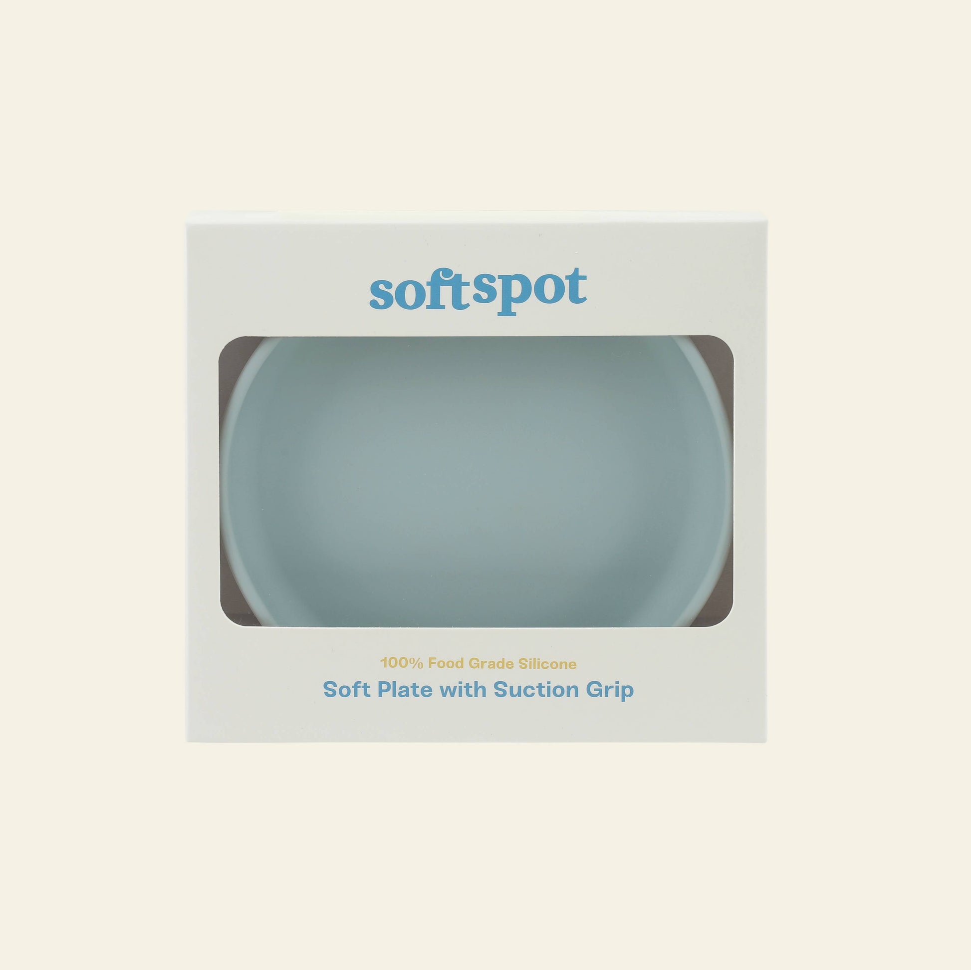 A light blue food-grade silicone Soft Spot Soft Suction Plate inside white packaging with a clear window. The brand name Soft Spot is printed on top, and Soft Plates with strong suction grip appears below the window.