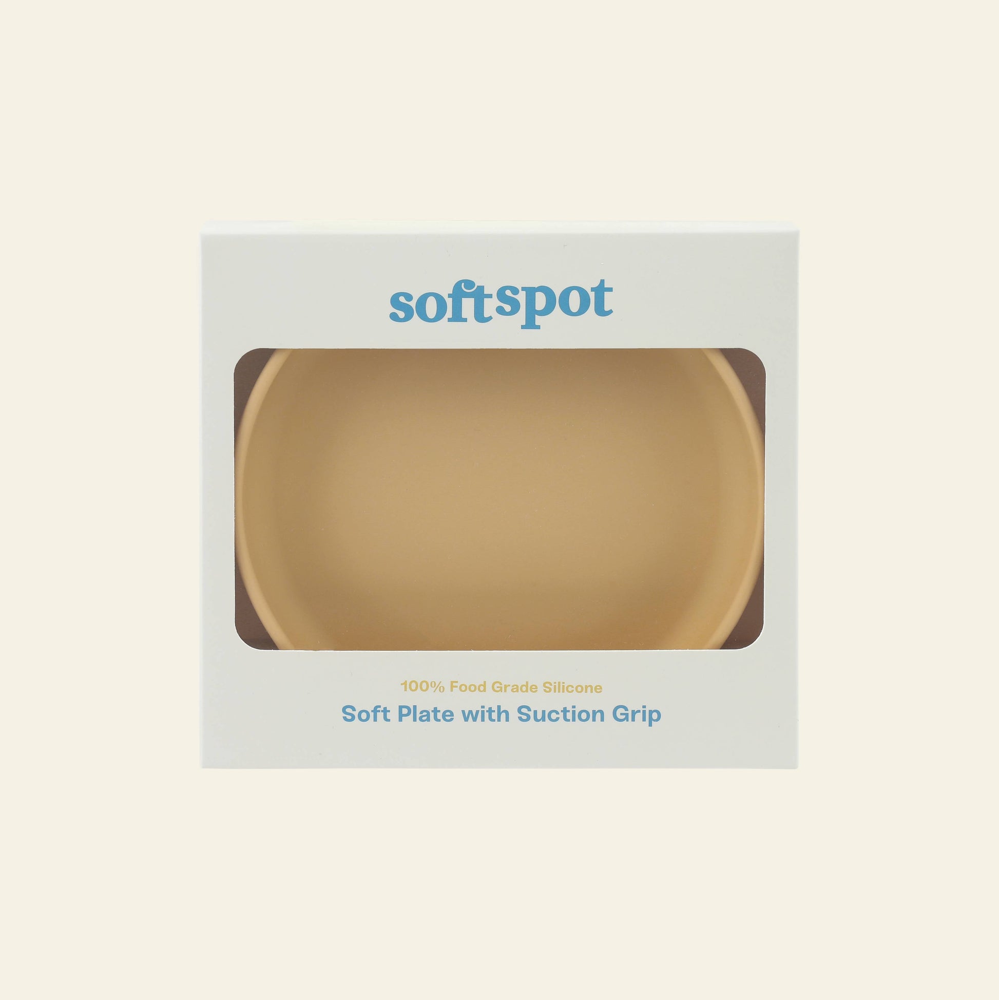 A beige Soft Spot Soft Suction Plate, made from 100% food-grade silicone with a strong suction grip, comes in white packaging with a clear window. softspot appears at the top, highlighting its silicone and suction features below.