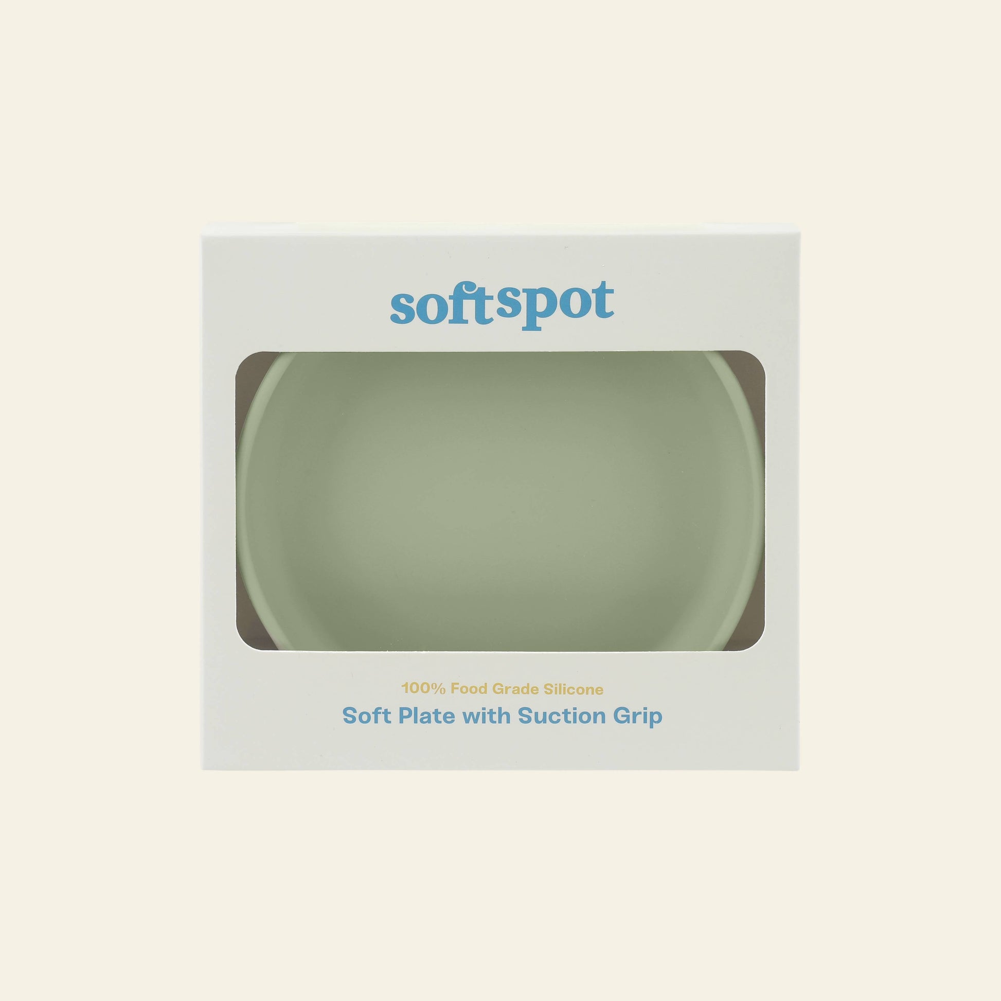 A pale green Soft Spot Soft Suction Plate made of food-grade silicone is visible through a window on the white Soft Spot box, labeled with the product name and featuring a strong suction grip for secure use.