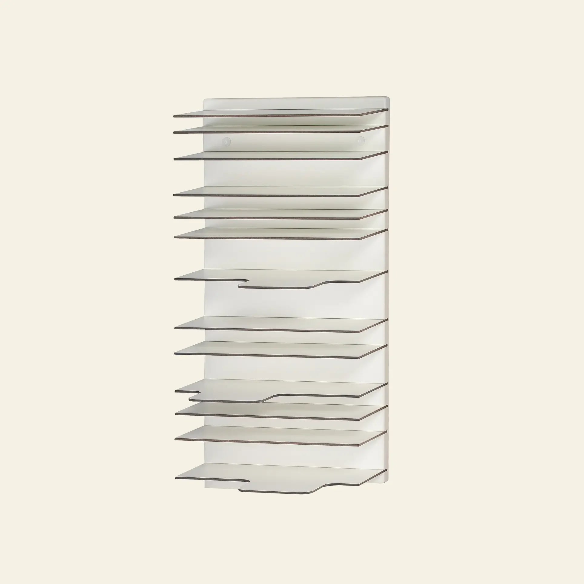 The Spectrum Paperback Wallsystem 30x60 by Spectrum is a wall-mounted vertical organizer with twelve angled white shelves in a minimalist design, ideal for papers or folders, displayed against a plain light background.