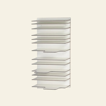 The Spectrum Paperback Wallsystem 30x60 by Spectrum is a wall-mounted vertical organizer with twelve angled white shelves in a minimalist design, ideal for papers or folders, displayed against a plain light background.