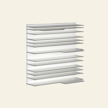 The Spectrum Paperback Wallsystem 60x60 by Spectrum is a modern, minimalist wall-mounted shelf unit with a modular design. It features multiple thin, evenly spaced horizontal shelves against a plain light background, crafted from durable materials.