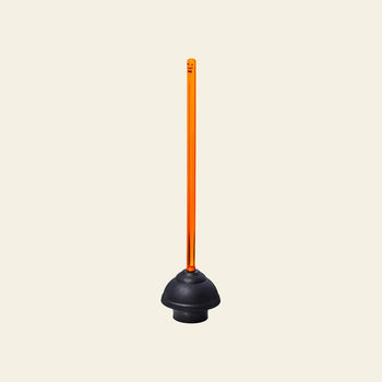 Staff The Plunger by Staff features a black rubber cup with a long, straight, translucent orange handle, standing upright against a plain light beige background—a must-have bathroom essential for every home.