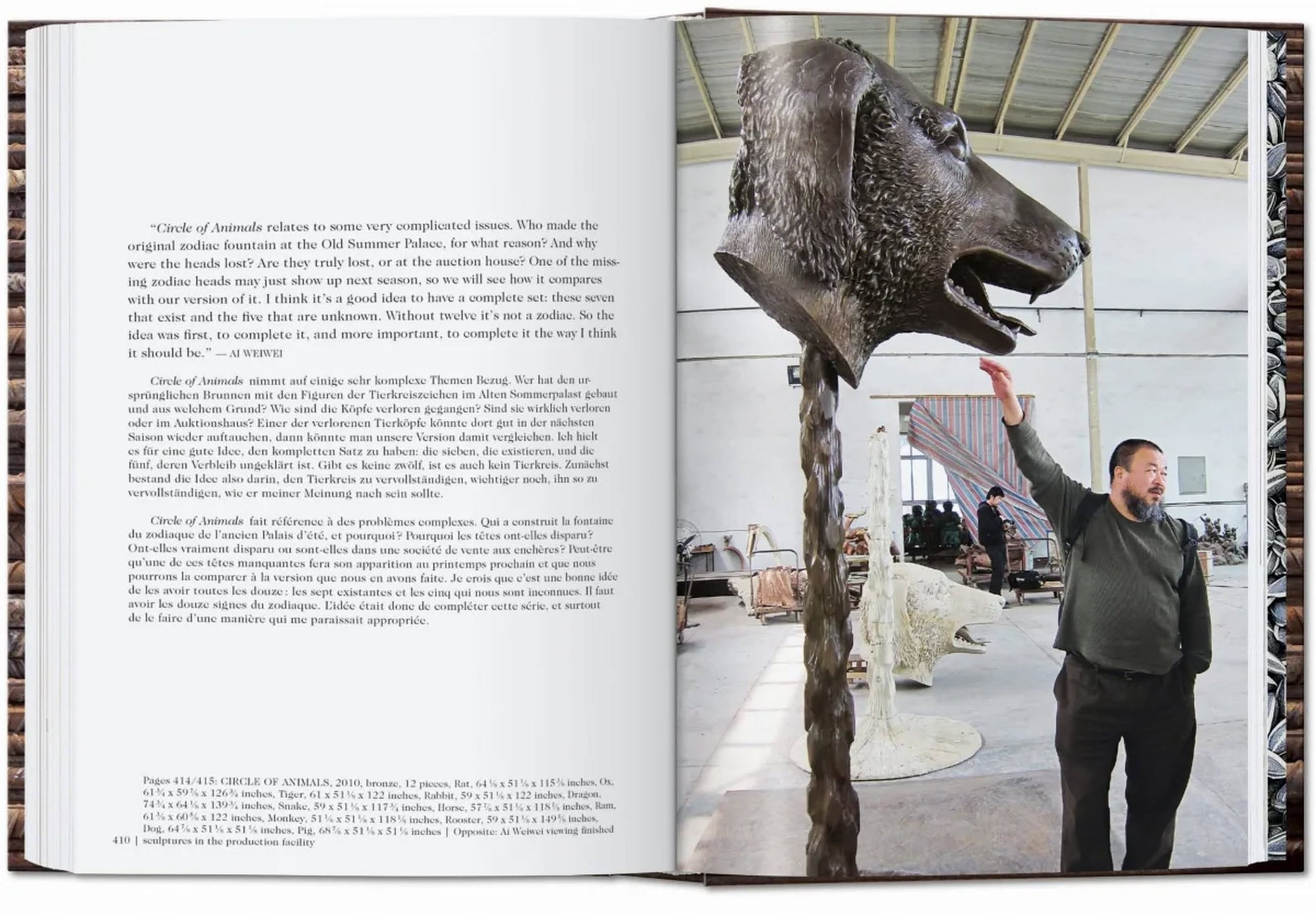 A man in a spacious studio reaches up to touch a large bronze animal head sculpture by Ai Weiwei, as featured in the TASCHEN Ai Weiwei monograph. The opposite page shows multilingual text blocks.