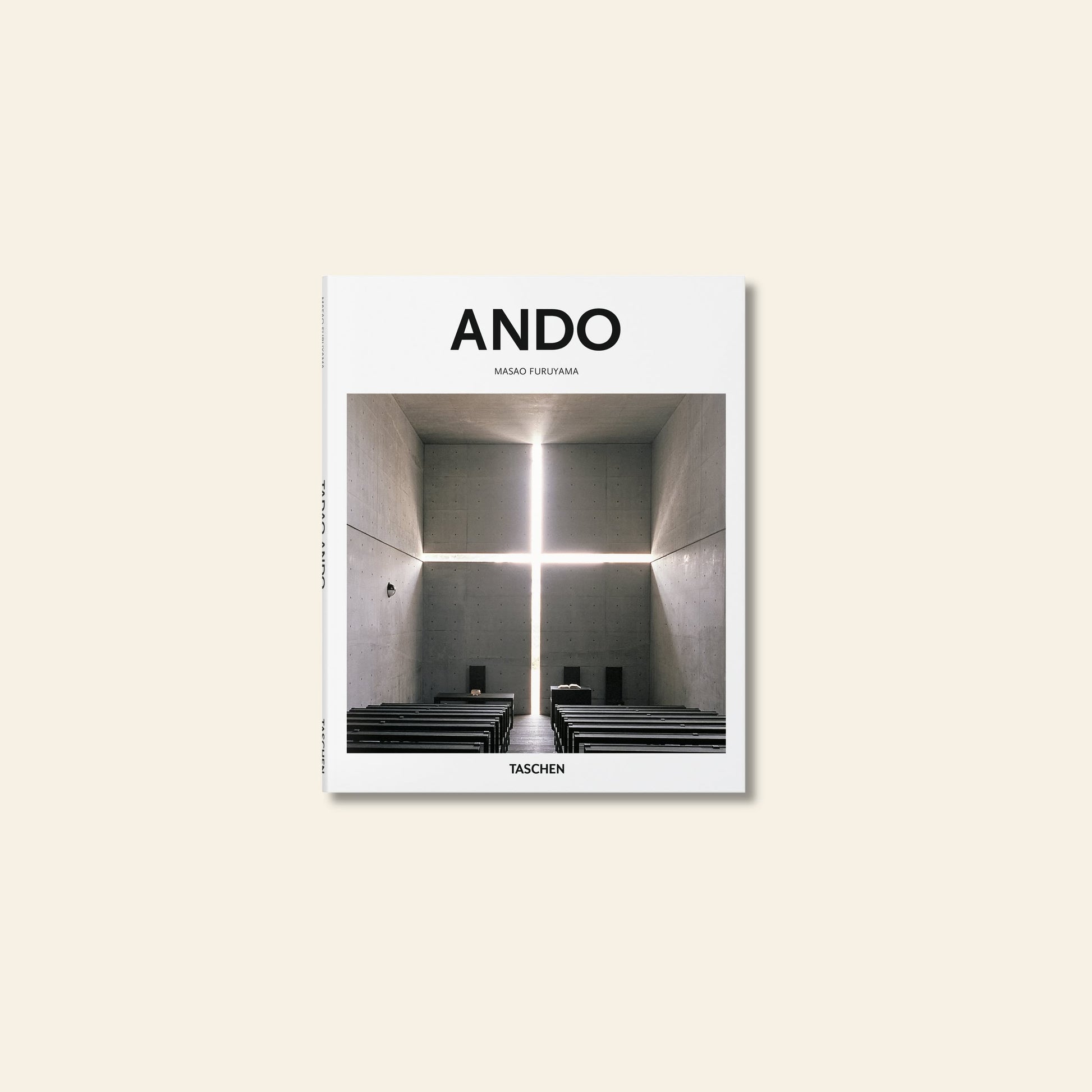 The image shows the cover of TASCHEN Ando by TASCHEN, featuring a minimalist church interior with benches and a striking cross-shaped window, capturing Tadao Ando’s modernist style. The brand name appears at the bottom.