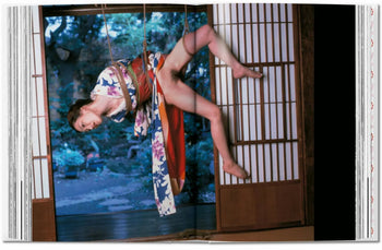 A person in a floral kimono, suspended by ropes with eyes closed, channels TASCHEN Araki's photography, set before shoji screens framing a lush garden—an evocative scene inspired by the iconic TASCHEN brand.