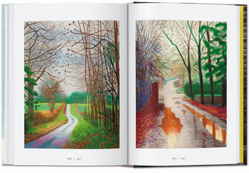 The TASCHEN David Hockney: A Chronology book by TASCHEN opens to vibrant landscape paintings of winding roads—one with leafless trees and green fields, the other featuring autumn hues and puddles—evoking iconic Hockney visuals.