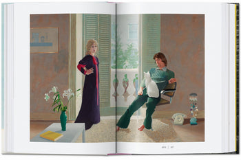 The TASCHEN David Hockney: A Chronology book features artwork in the iconic Hockney style, depicting a woman standing and a man seated with a white cat in an elegant, sunlit room adorned with flowers and pastel decor.