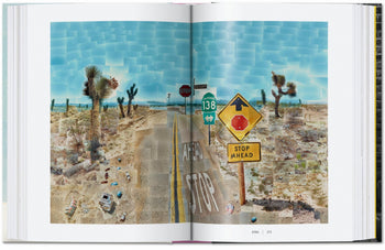 A collage-style photo inspired by David Hockney graces an open copy of TASCHEN’s "David Hockney: A Chronology," showing a desert intersection with “Stop” signs, Joshua trees, and debris beneath a vivid blue sky.