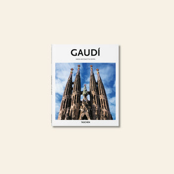 TASCHEN Gaudí by TASCHEN explores Antoni Gaudí’s visionary designs, with the Sagrada Família’s spires set against a blue sky and a plain beige background.