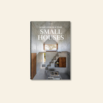TASCHEN Homes for Our Time: Small Houses (XL) by TASCHEN features a book cover showcasing a modern, minimalist interior with concrete walls, wood accents, and a large window framing nature—highlighting sustainable petite architecture.