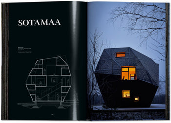 An open book from TASCHENs Homes for Our Time: Small Houses (XL) displays a geometric, dark house with glowing orange windows at dusk; the left page shows a labeled section drawing under the title SOTAMAA.