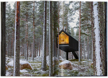 The TASCHEN Homes for Our Time: Small Houses (XL) book by TASCHEN showcases modern small cabins set among snowy trees, featuring large windows and cozy, sustainable living—perfect inspiration for winter retreats.