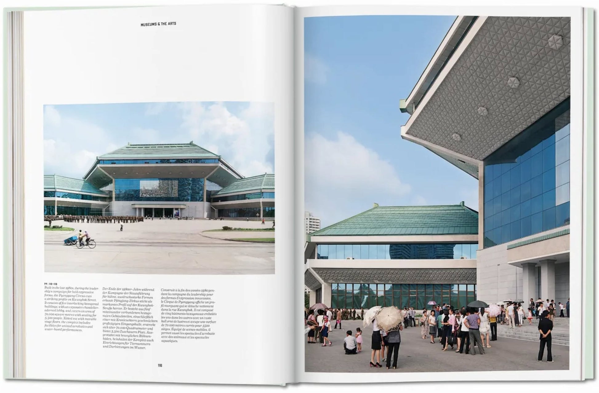 A large crowd gathers outside a modern building with green-tiled roofs and glass facades—a scene straight from TASCHEN Inside North Korea, where striking architecture and wide steps invite photographers and intrigue fans of TASCHENs explorations.