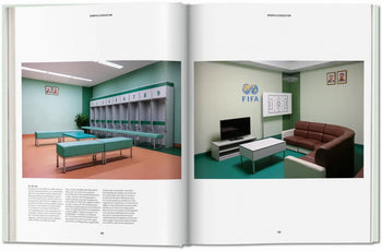 A spread from TASCHEN Inside North Korea features a locker room with benches and lockers on one page, and a lounge with brown couch, TV, FIFA logo, and tactics board on the other—echoing TASCHEN’s architectural style.