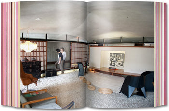 An open book, TASCHEN Project Japan: Metabolism Talks, displays a modern living room with two people, mid-century furniture, and soft light. The right page shows chairs and minimalist interiors inspired by Japanese design from TASCHEN.