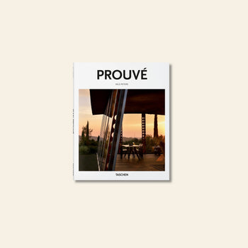 The cover of TASCHEN Prouvé by Nils Peters, published by TASCHEN, features a modern glass building at sunset amid trees, reflecting Jean Prouvé’s innovative approach to midcentury materials and design.