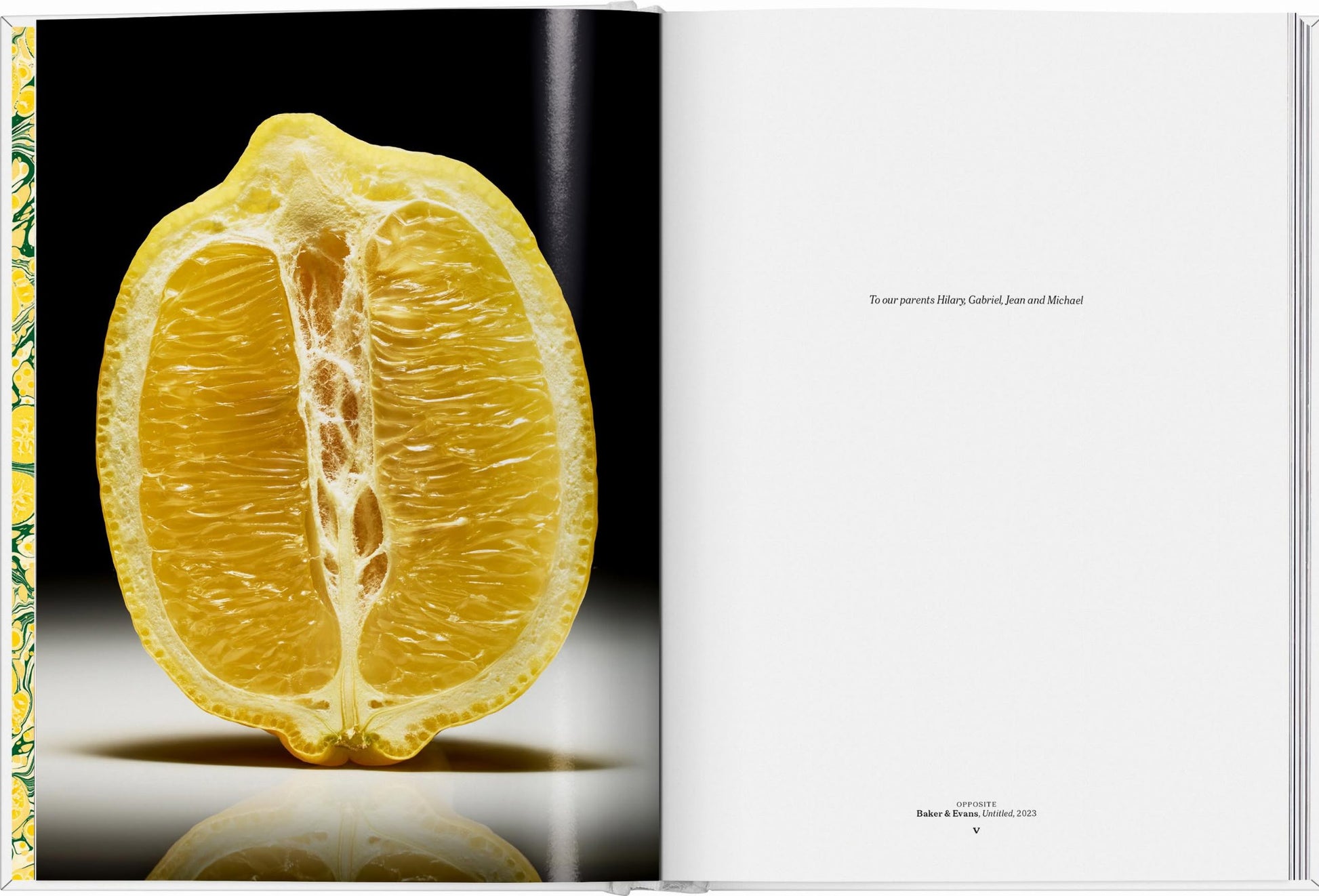 An open TASCHEN The Gourmands Lemon: A Collection of Stories and Recipes displays a photo of halved lemons on the left—a tribute to culinary experts—while the right page features a dedication to Mikey, Gabriel, Jamie, and Michael.