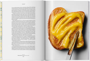 The TASCHEN The Gourmands Lemon: A Collection of Stories and Recipes by TASCHEN is open to a foreword beside a close-up of toast being spread with bright lemon curd—ideal visual inspiration for cooking enthusiasts.