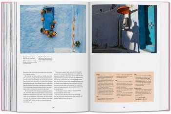 An open TASCHEN The New York Times Explorer: 100 Dream Trips Around the World book displays vivid photos of a blue Mediterranean window with oranges and an orange payphone, inspiring readers to discover dream destinations and hidden gems.
