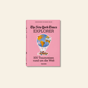 The TASCHEN The New York Times Explorer: 100 Dream Trips Around the World is a pink travel guide featuring a hot air balloon illustration—your ideal companion for discovering dream destinations.