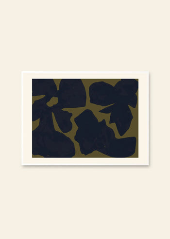 By Garmi - Desoleil (30x40) art print from The Poster Club features large, irregular dark shapes on an olive green background, bordered by a white mat and displayed against a light beige wall.