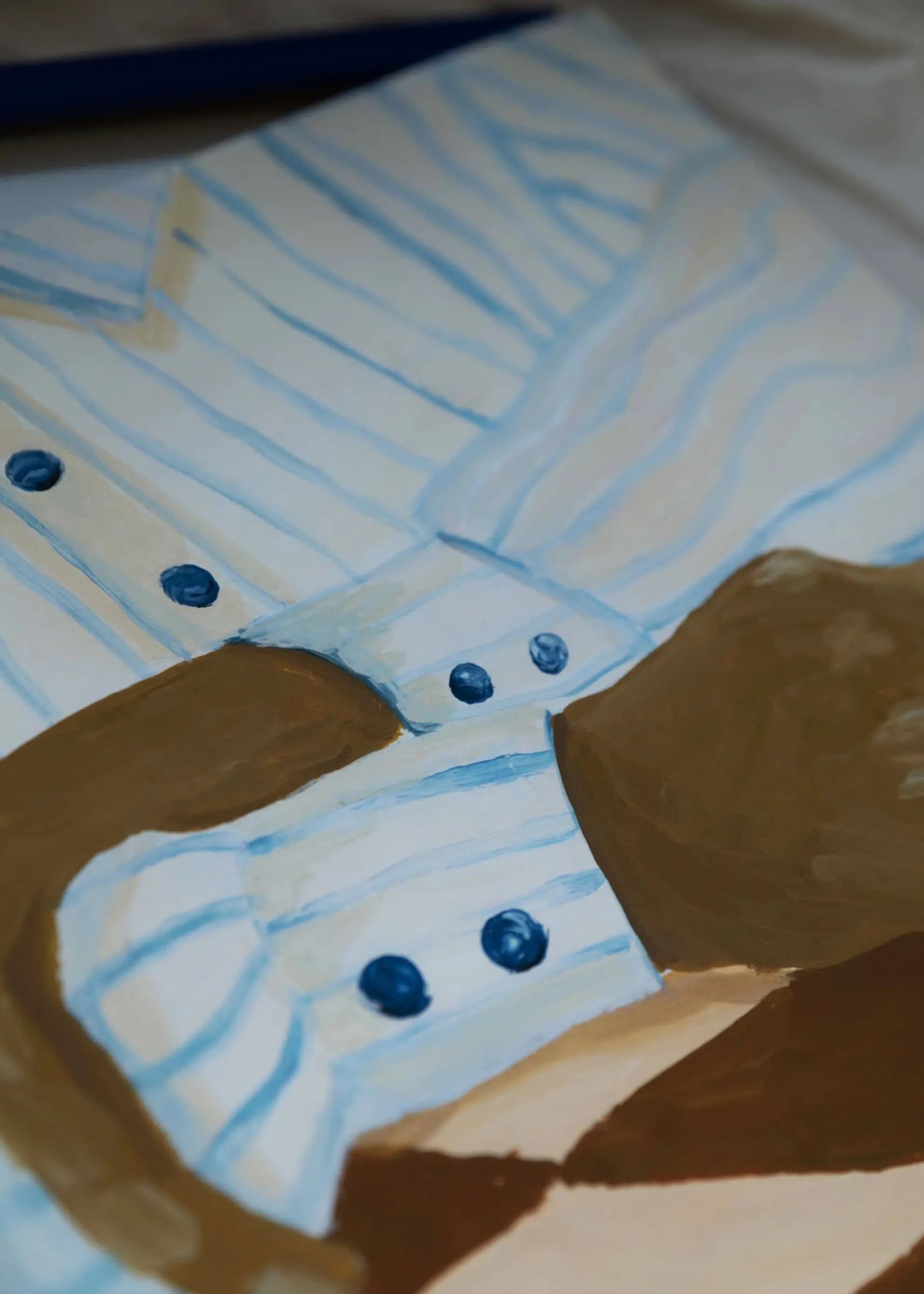 The Poster Club’s Hanna Peterson - Light Stripes (30x40) art print showcases a close-up of a light blue and white striped shirt with dark blue buttons, highlighting the cuff and sleeve in Hanna Peterson’s signature style.