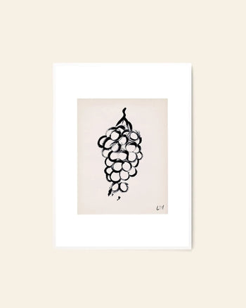 The Poster Club Lena Wigers - Grapes (50x70) features a minimalist black ink grape bunch drawing on white, framed against beige. A fine art giclée print, signed LM, capturing Lena Wigers’ signature style for The Poster Club.