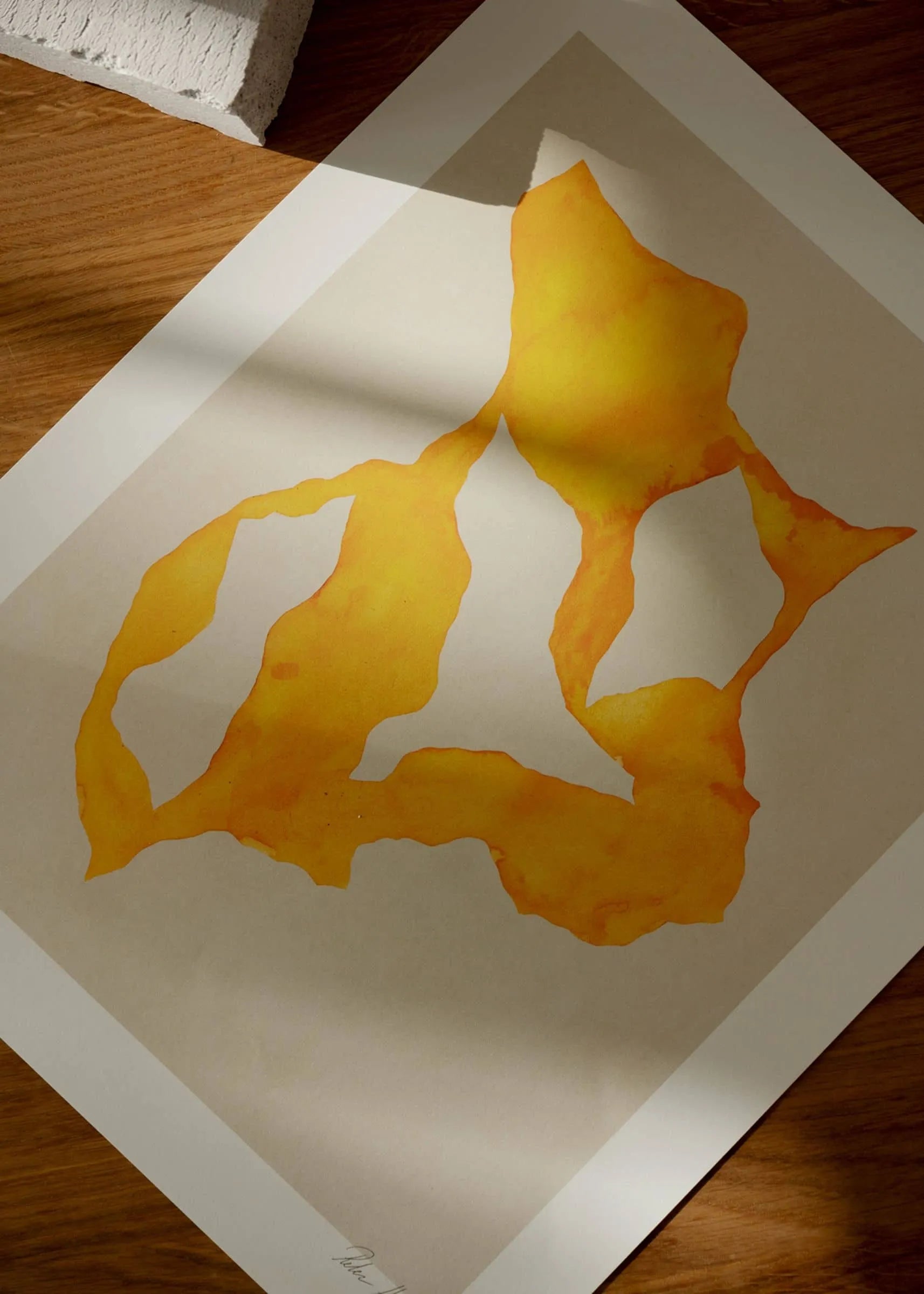 Rebecca Hein - Shadow No. 14 (30x40) by The Poster Club features a bold abstract yellow form with white accents on a white backdrop, photographed on wood with a shadow—ideal for fans of Nordic-inspired art.